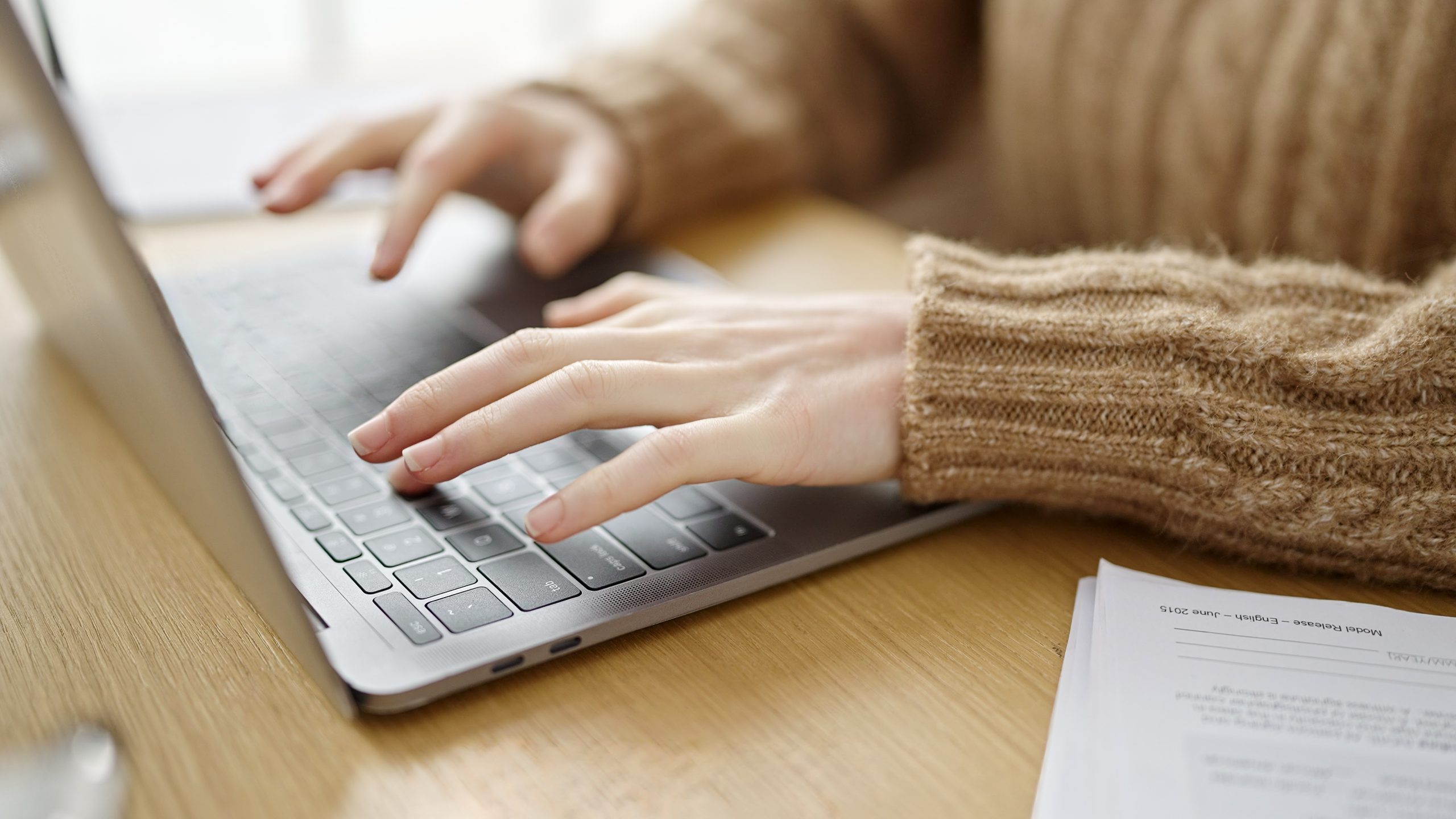 Young beautiful hispanic woman using laptop at office